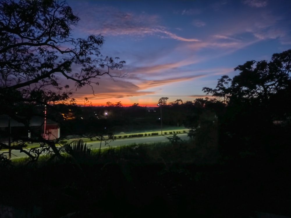 a sunset over a golf course