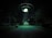 A dark outdoor setting illuminated by a large, glowing UFO hovering above. Three figures stand in its beam of light, surrounded by trees and parked cars. The scene is surreal and otherworldly, with an eerie green hue cast over the landscape.