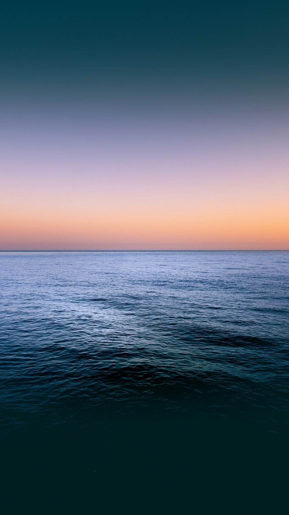 a body of water with a sunset