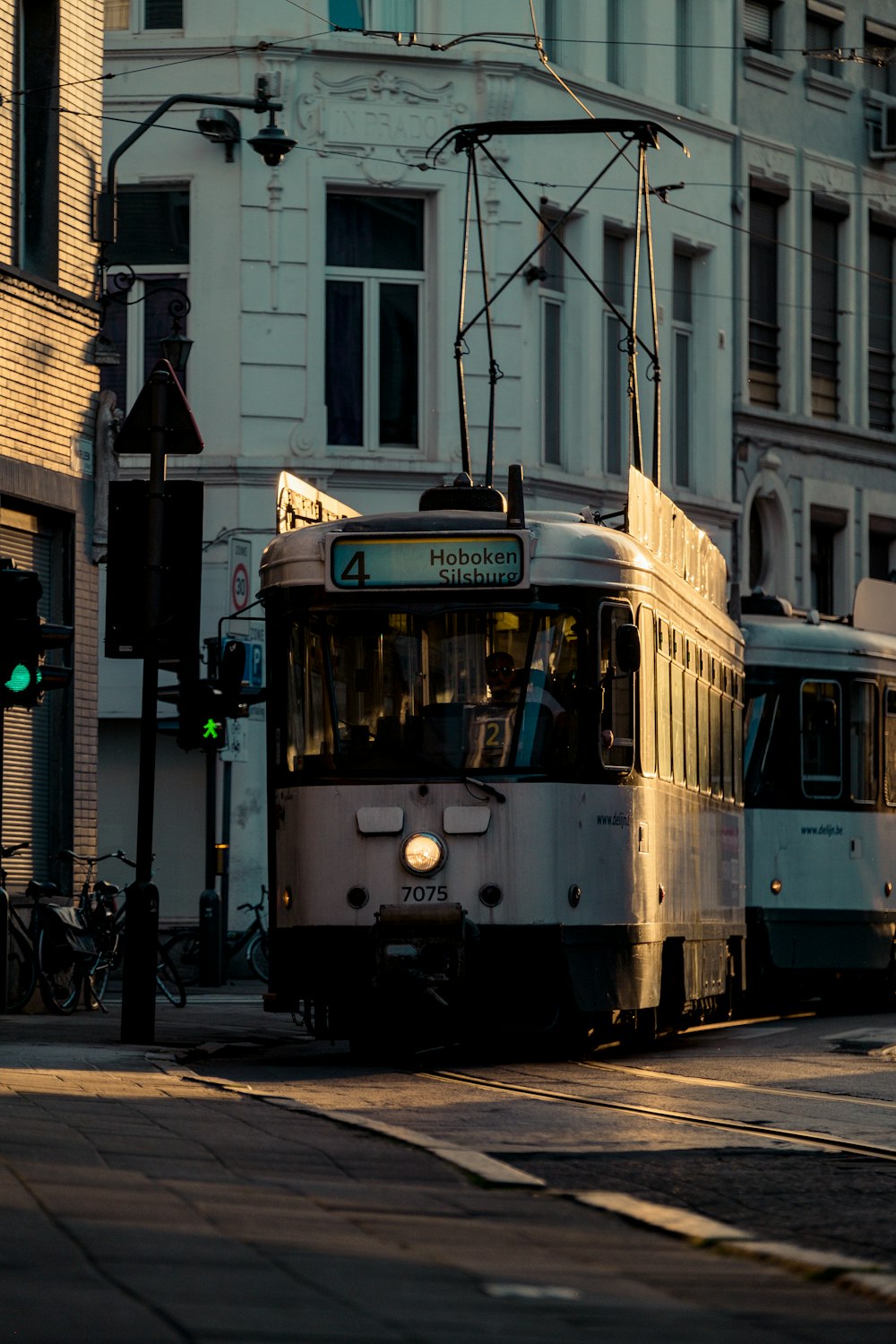 a white trolley on a street