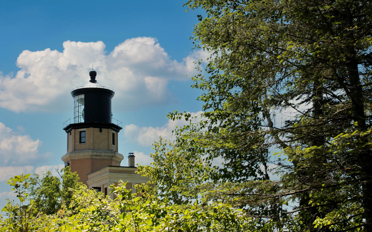 Split Rock Lighthouse rising among green trees
