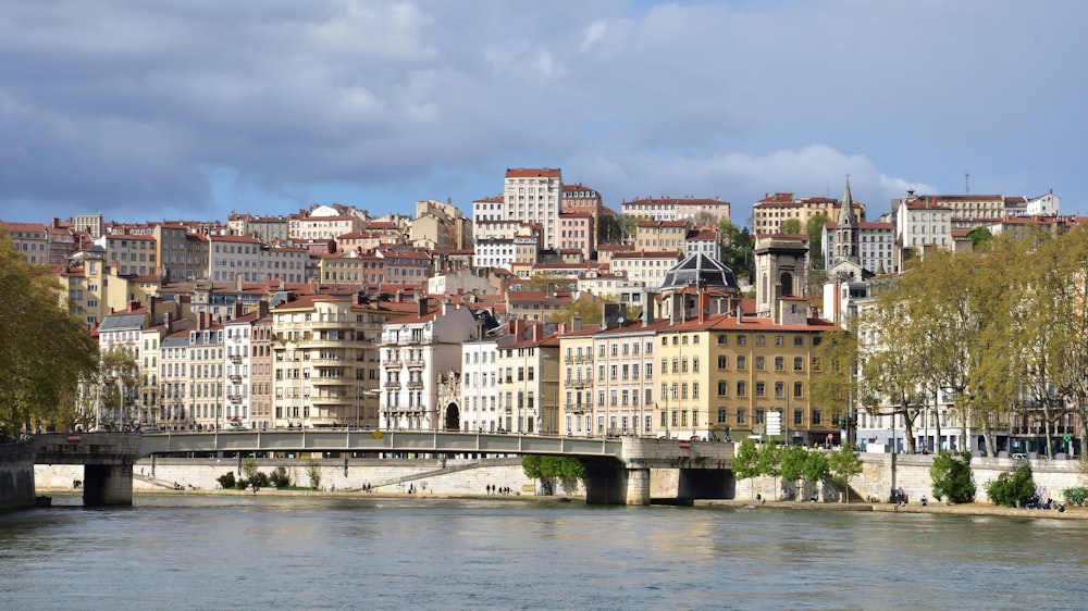 a bridge over a river with buildings on either side of it