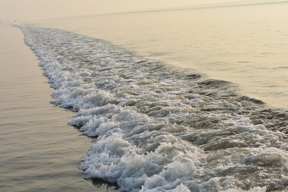 a body of water with waves