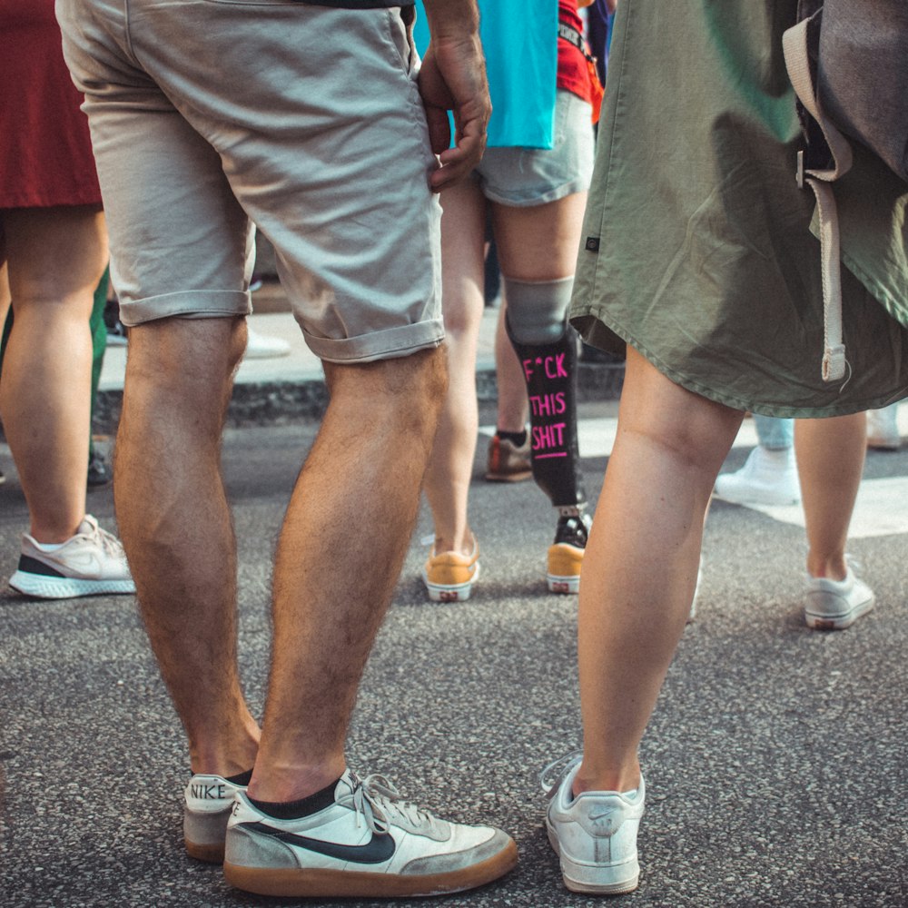 a group of people standing on a street