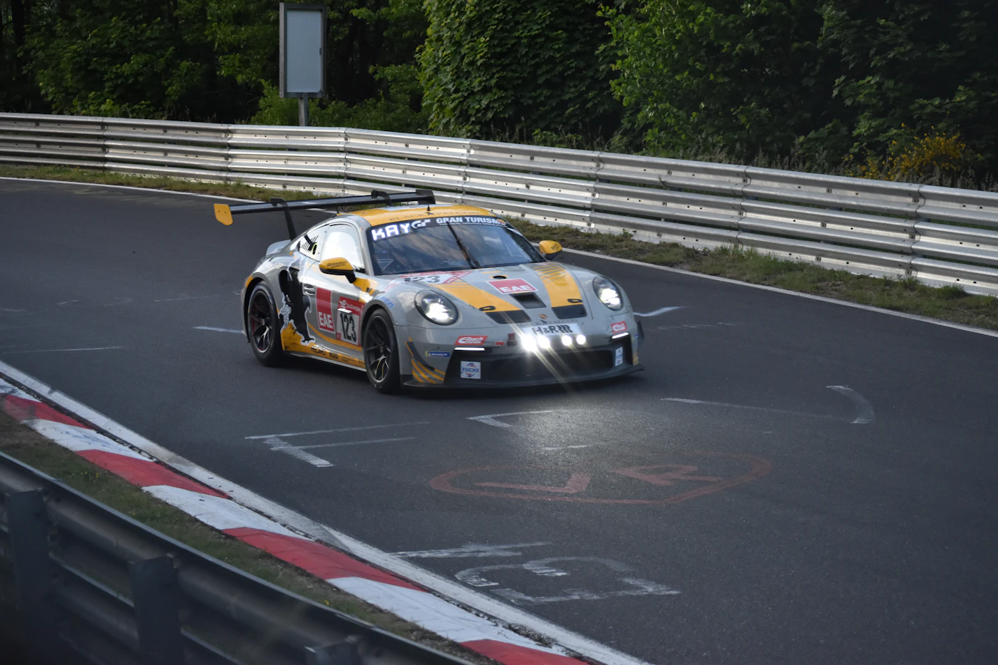 A race car on a race track, representing how motorsport regulations push engines toward extreme rev ranges