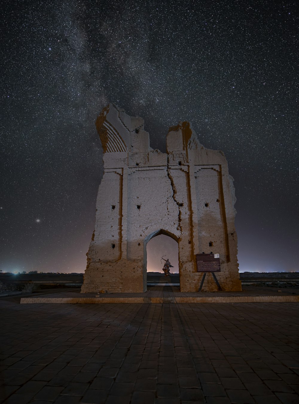 a large stone structure with a star in the sky