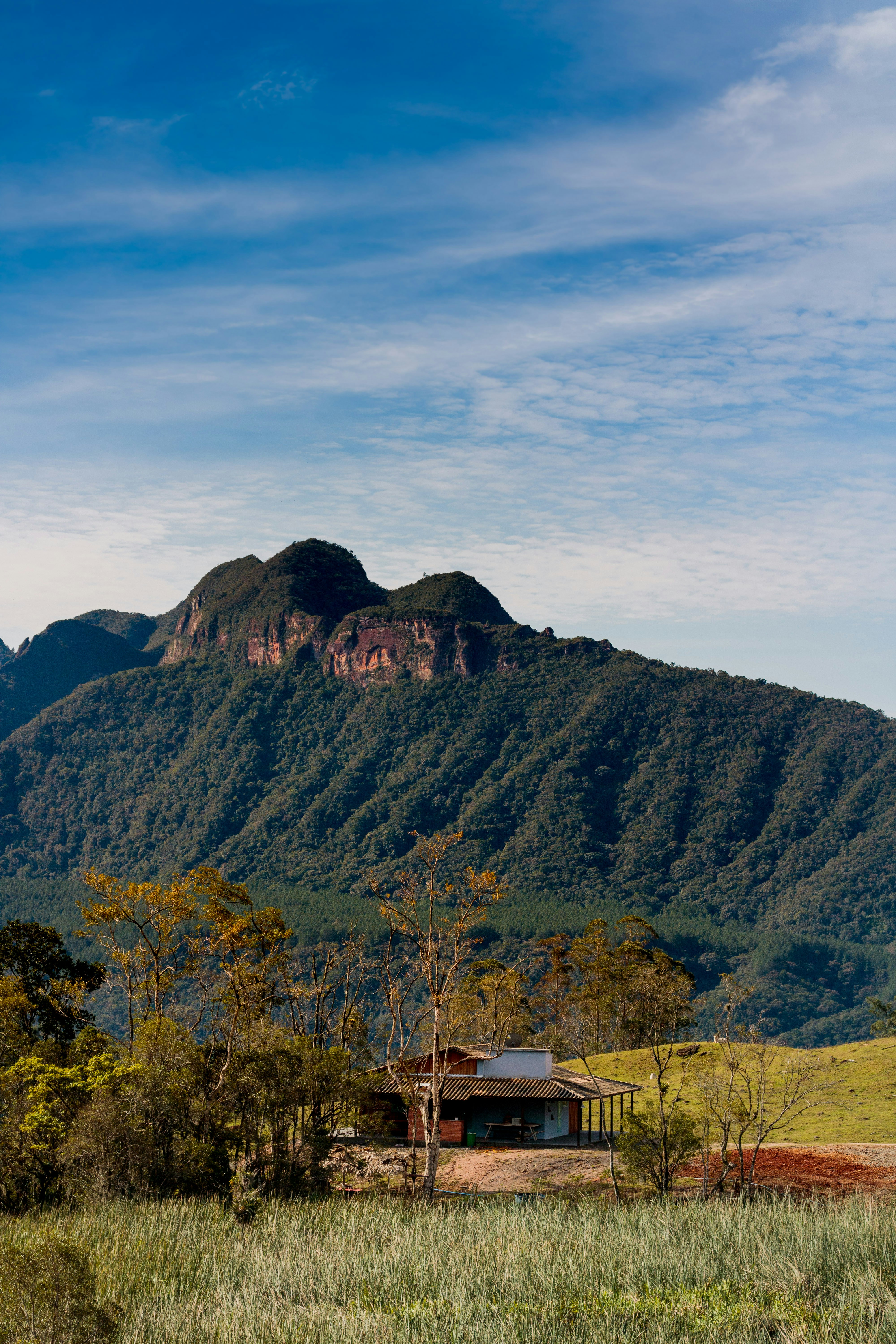 a house in front of a mountain