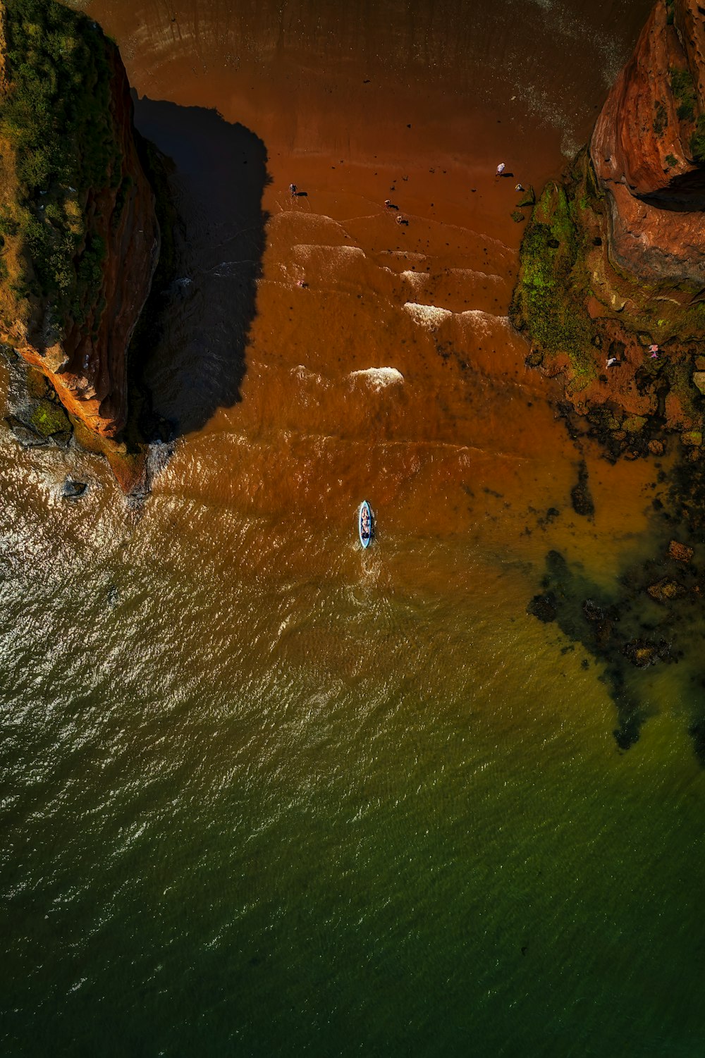 a body of water with a land with a body of water in the background