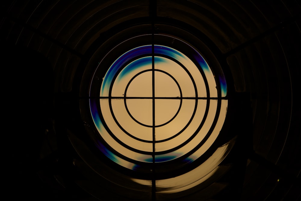 a circular window with a blue and green design