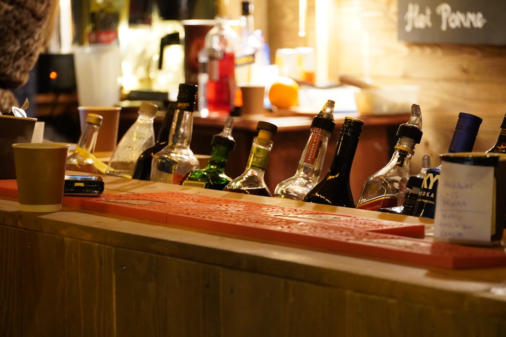 a counter with bottles of alcohol on it