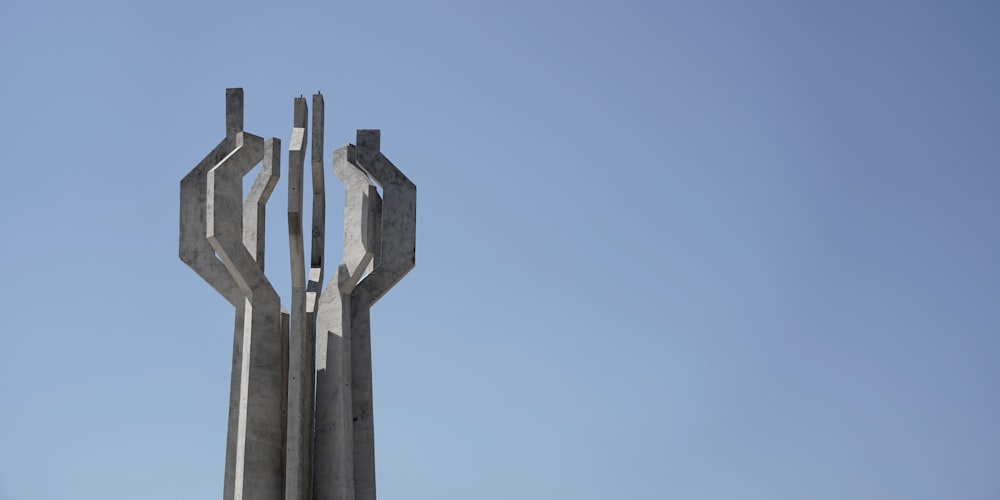 a stone tower with a cross on top