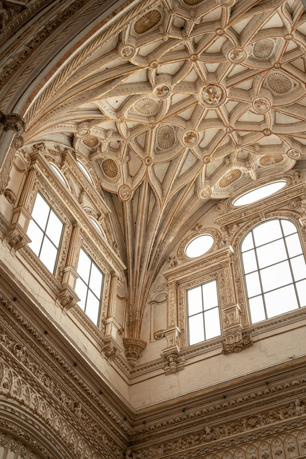 a ceiling with windows and a ceiling with a design