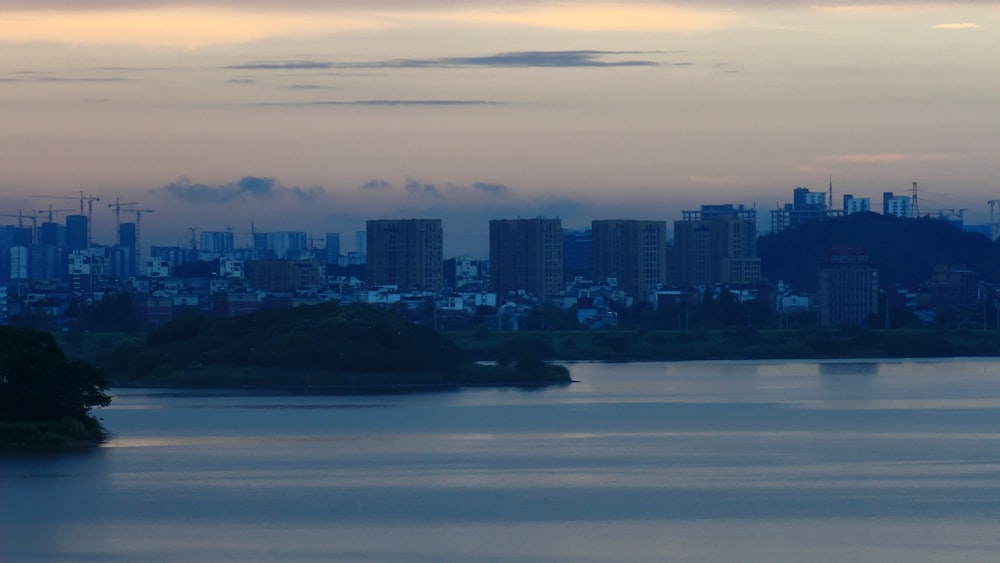 a city skyline across a body of water