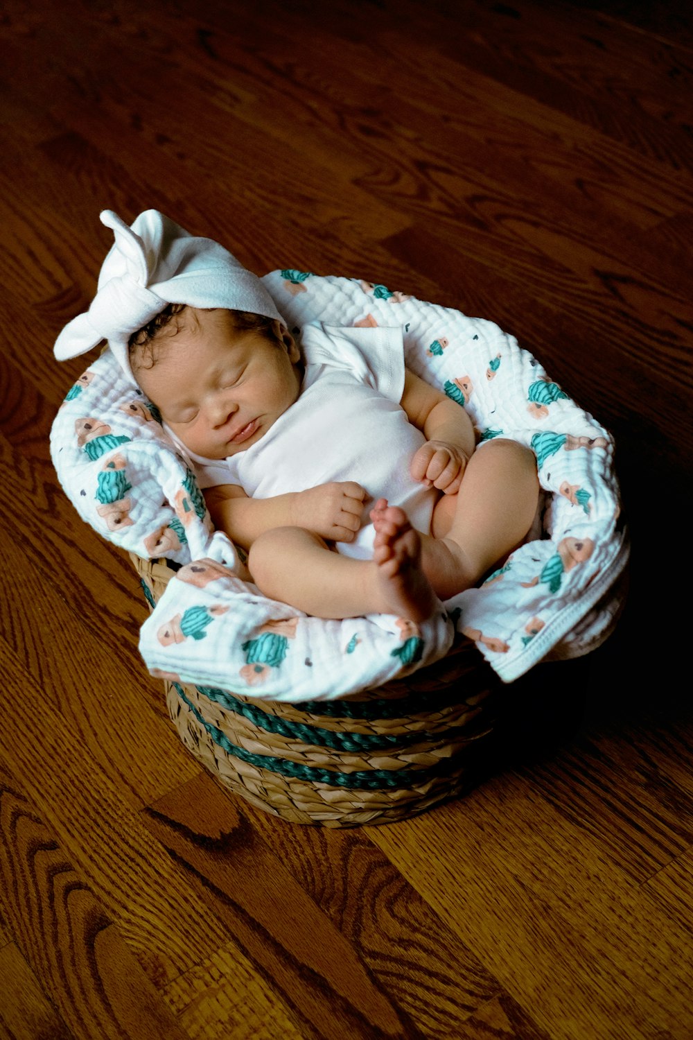 a baby sleeping in a basket
