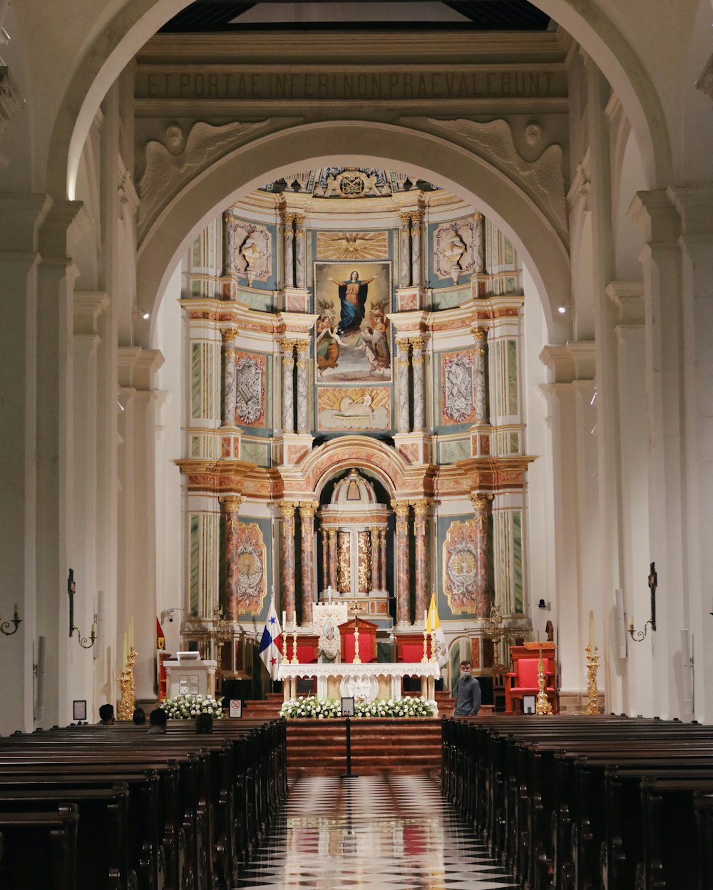 a large ornate church with a large stained glass window