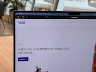 a computer screen with a window and a person in the background