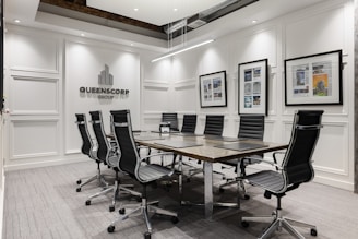 a conference room with a table and chairs