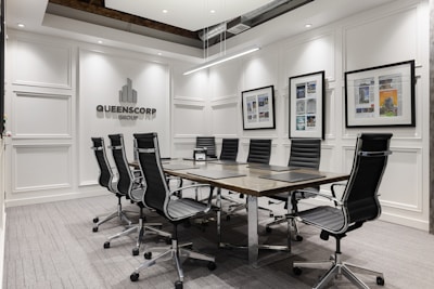 a conference room with a table and chairs