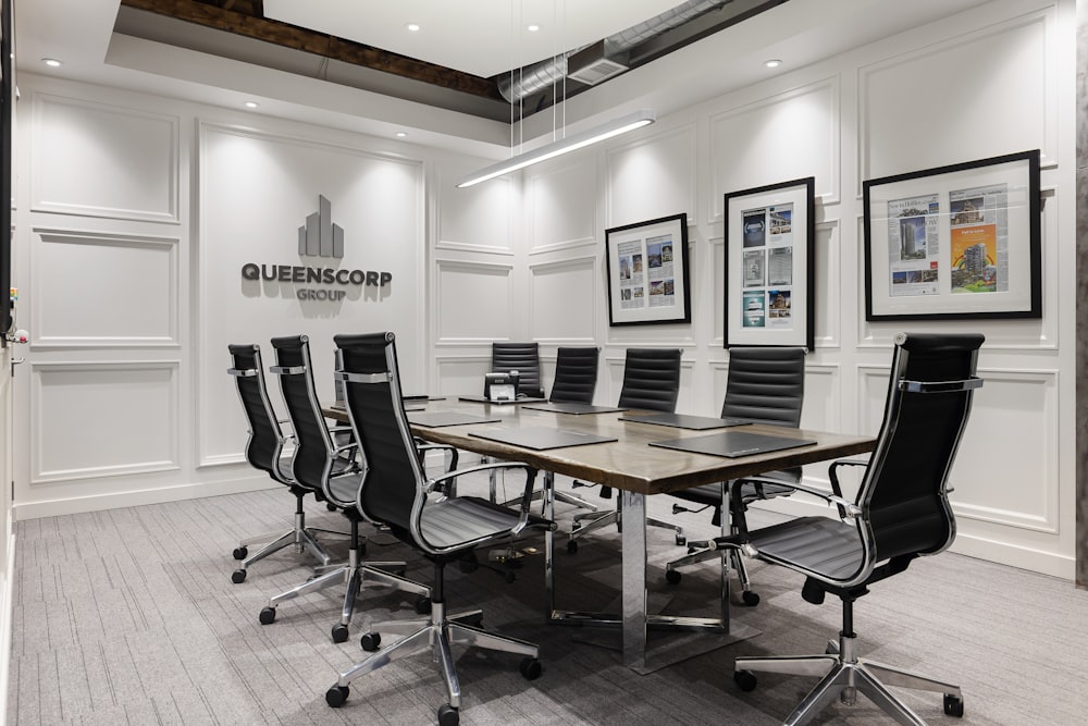 a conference room with a table and chairs