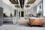 a room with a desk and chairs