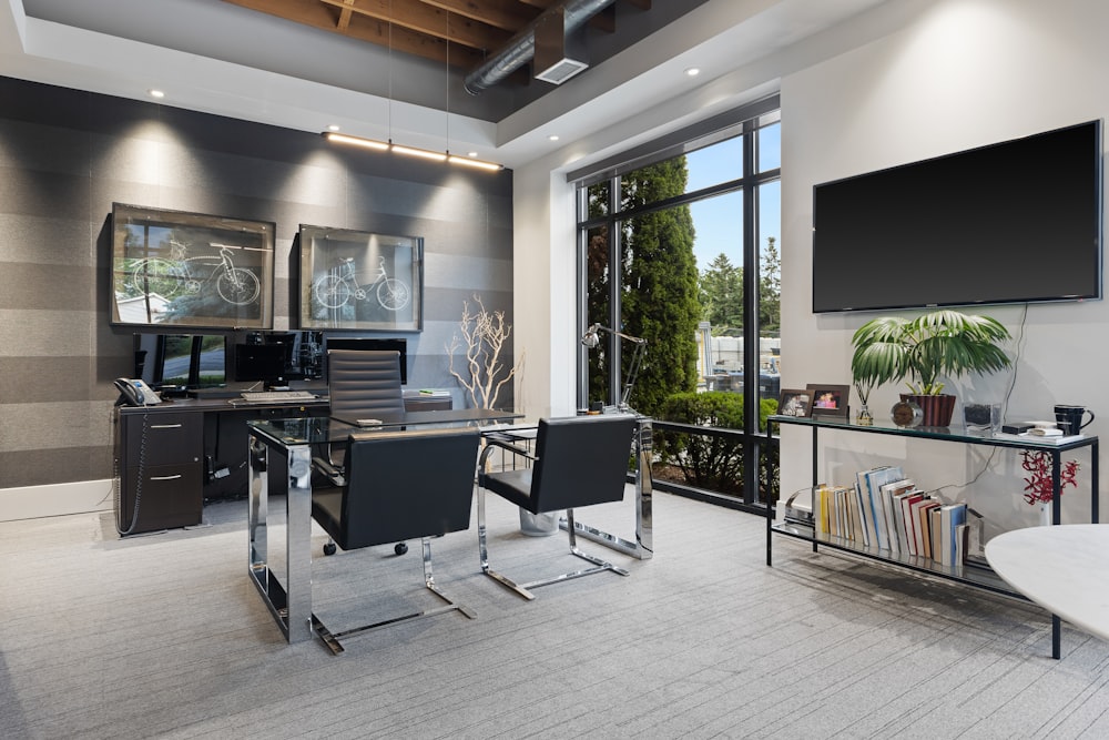 a room with a tv and chairs