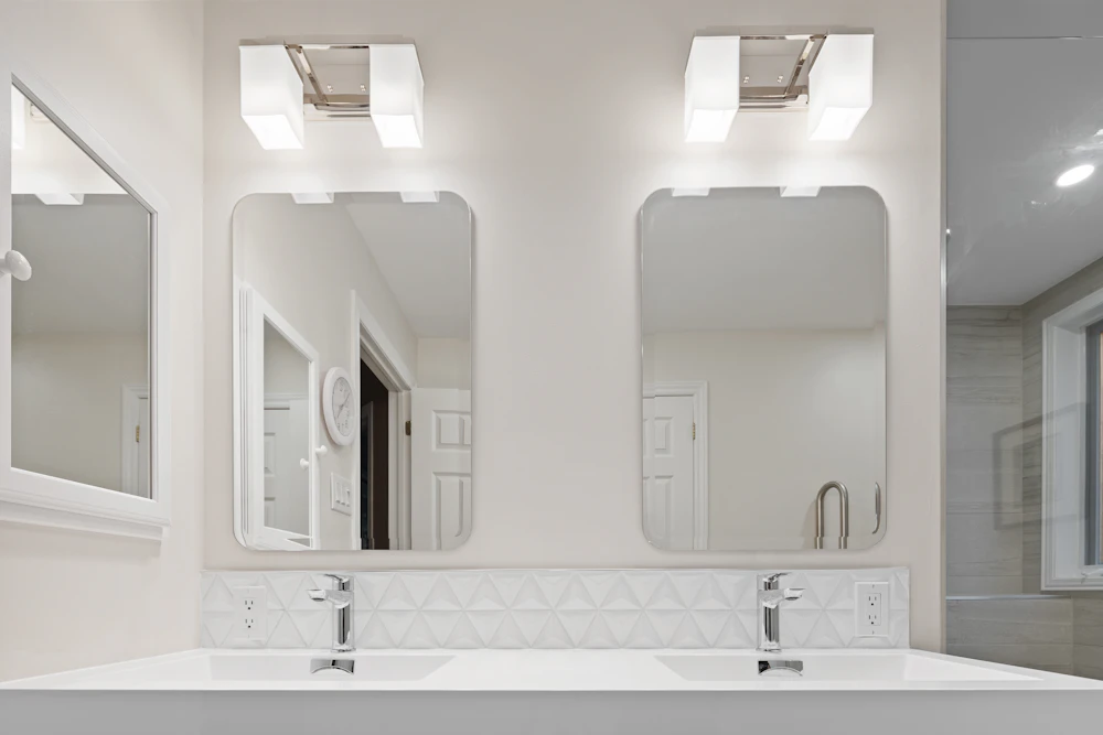 Bathroom with a double vanity and two mirrors, shown as cabinetry inspiration