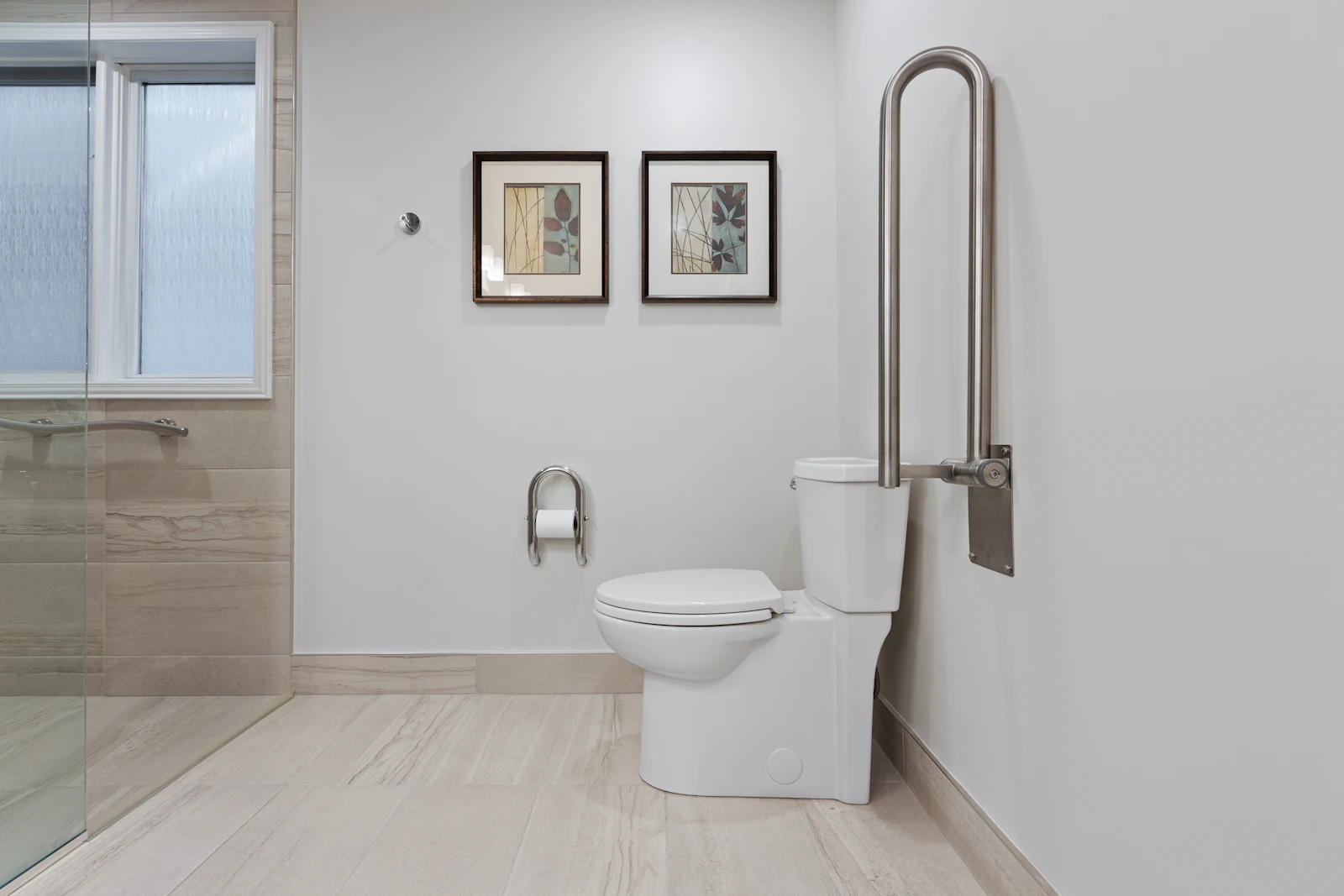 Bathroom with grab bars next to the toilet