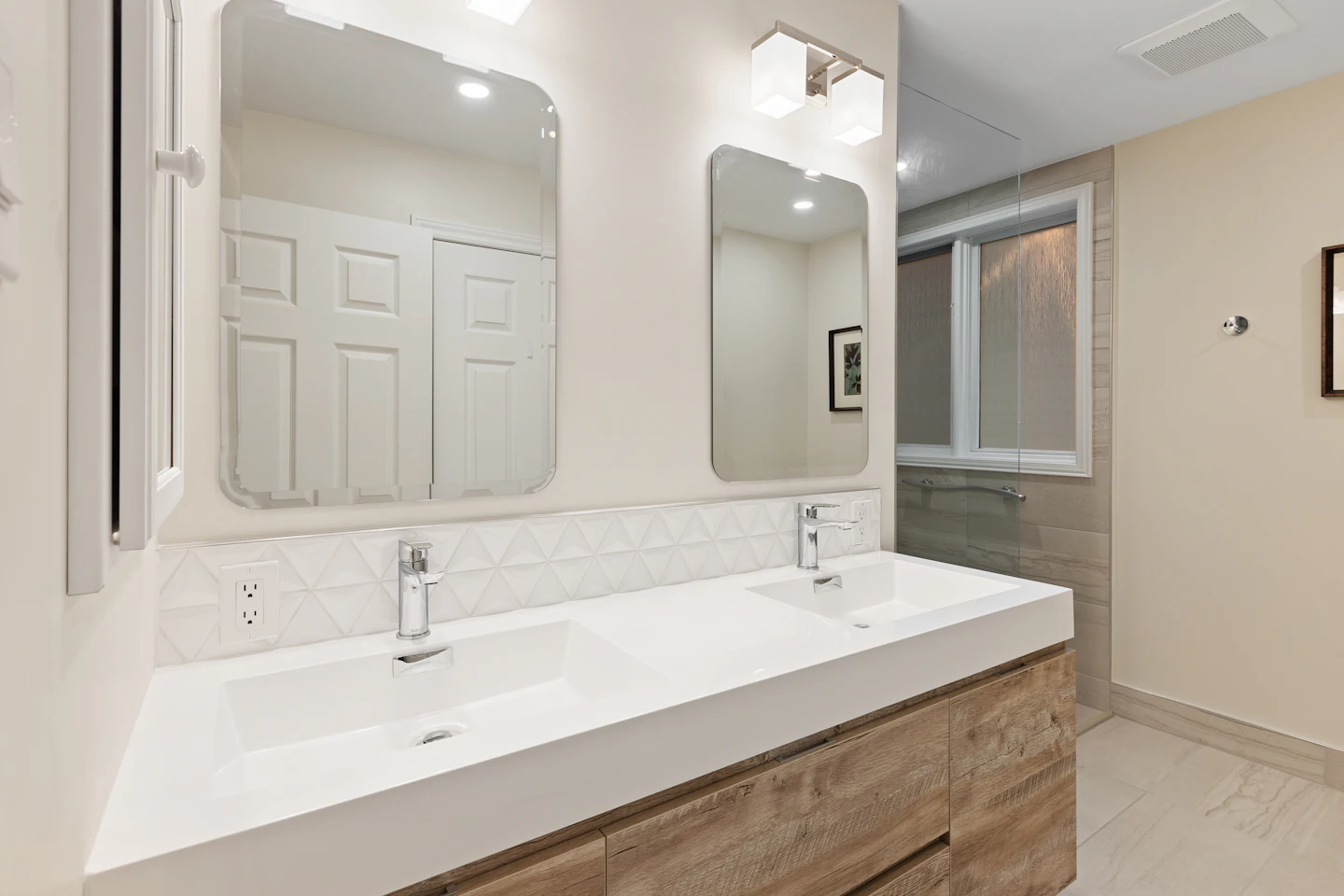 Wide vanity with a large mirror in an accessible bathroom