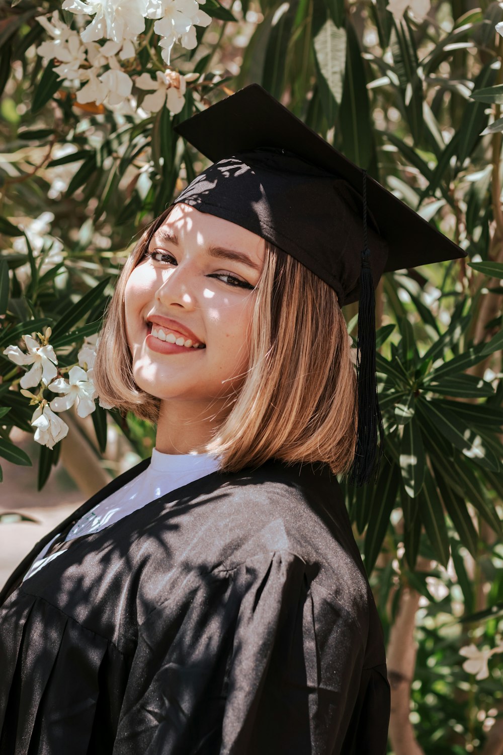 a woman wearing a graduation cap