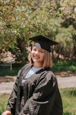 a person wearing a graduation cap and gown