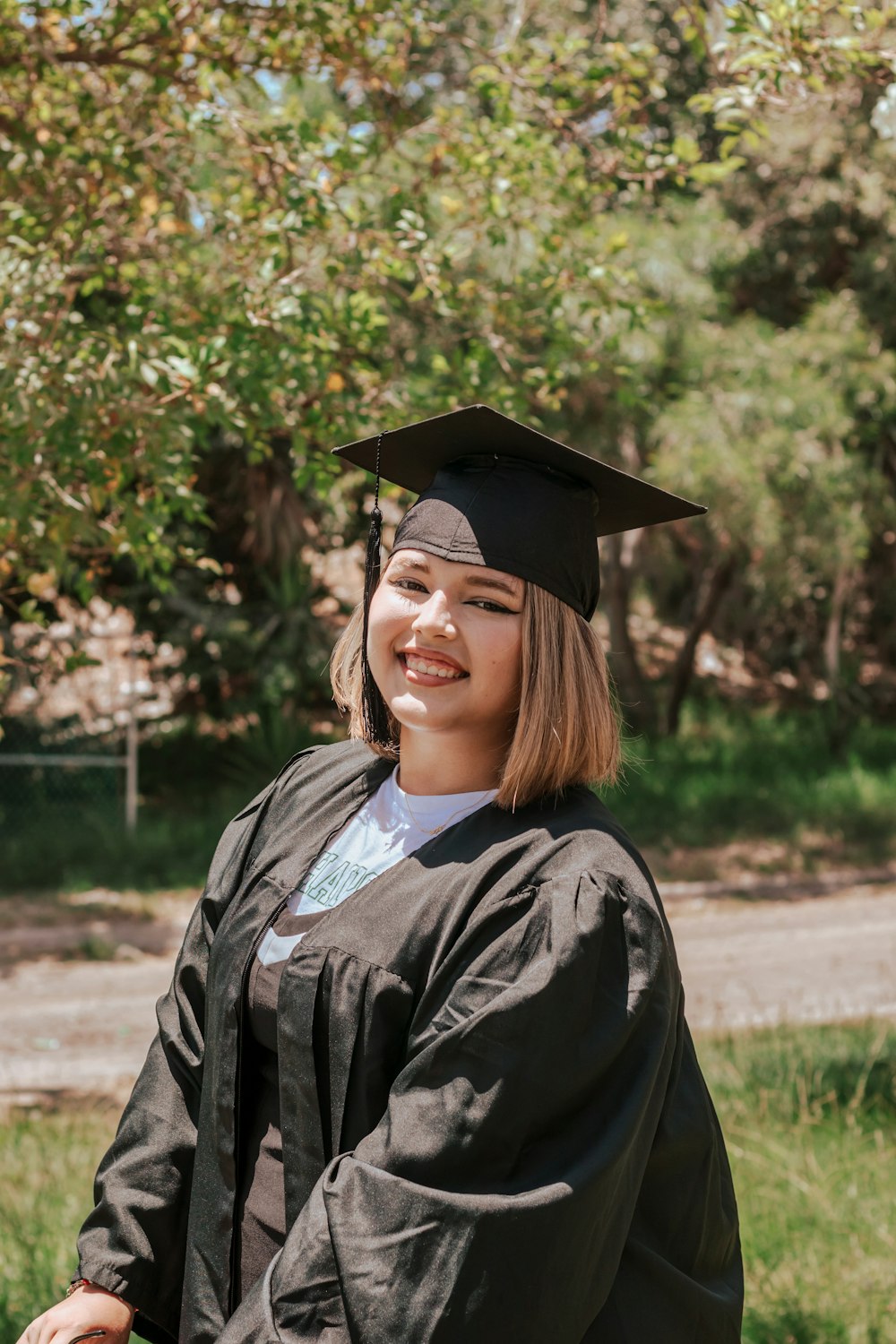 a person wearing a graduation cap and gown