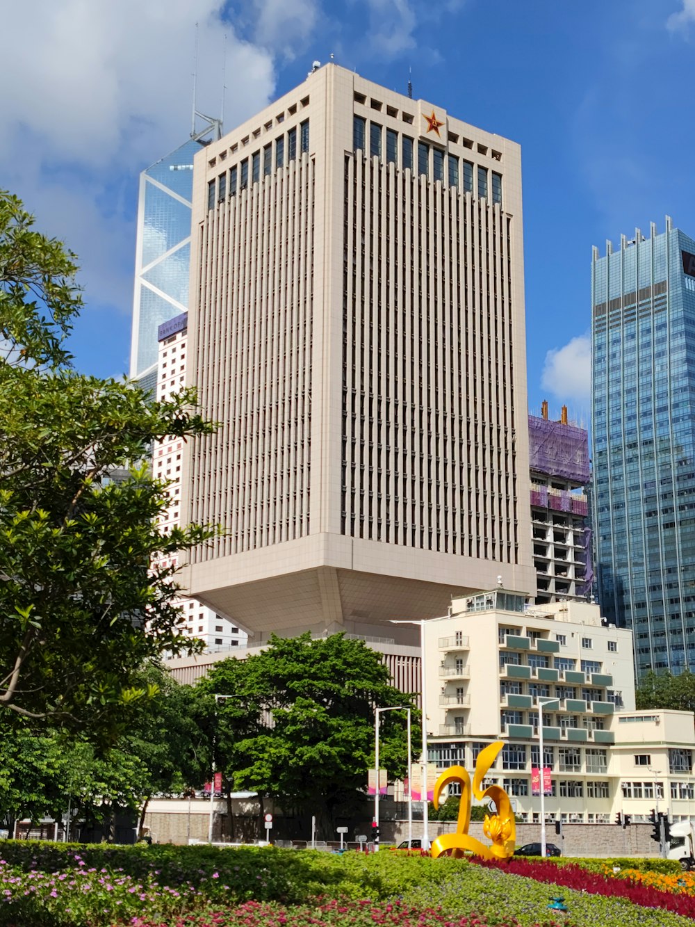 a tall building with many windows with Church Office Building in the background