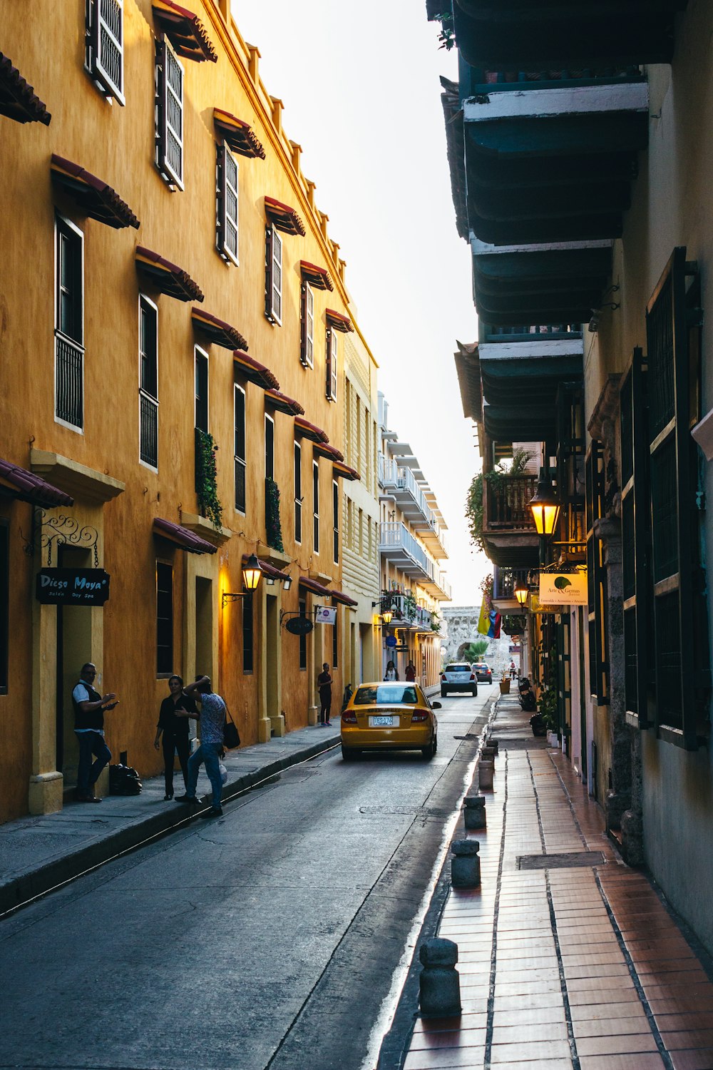 a street with cars and people on it