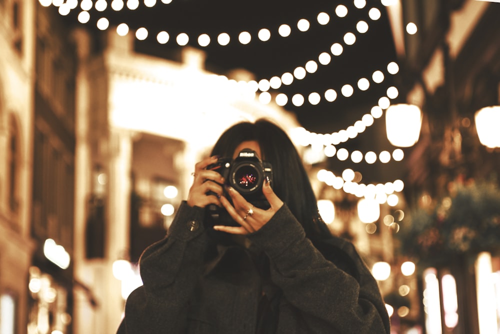 a person holding a camera