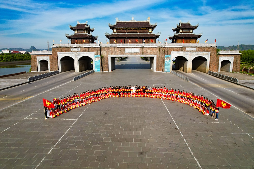 a large building with a large group of people in front of it