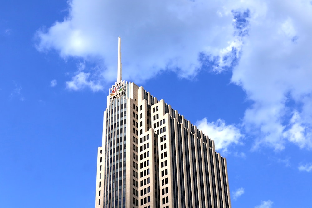 a tall building with a blue sky