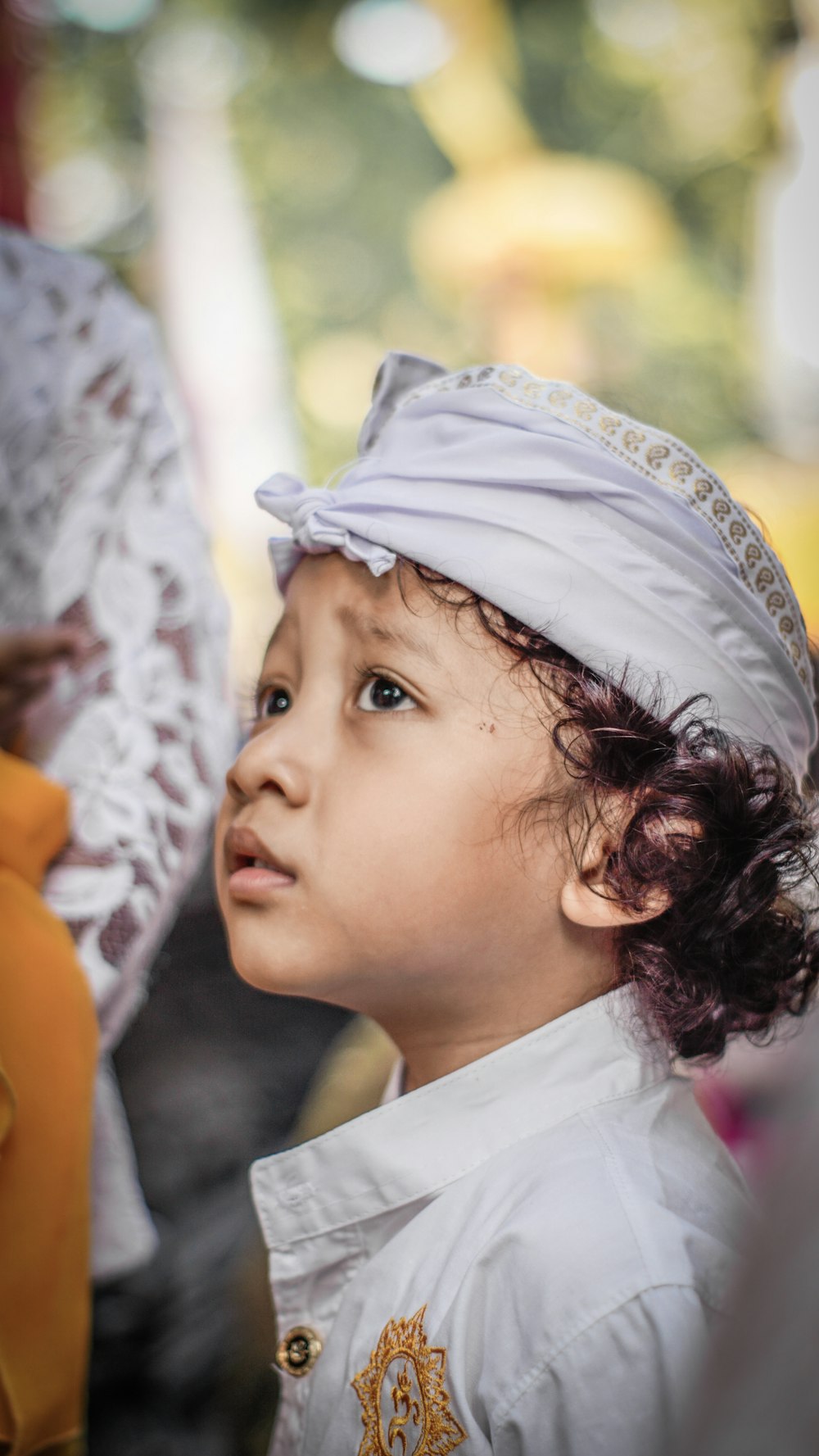 a young girl wearing a hat