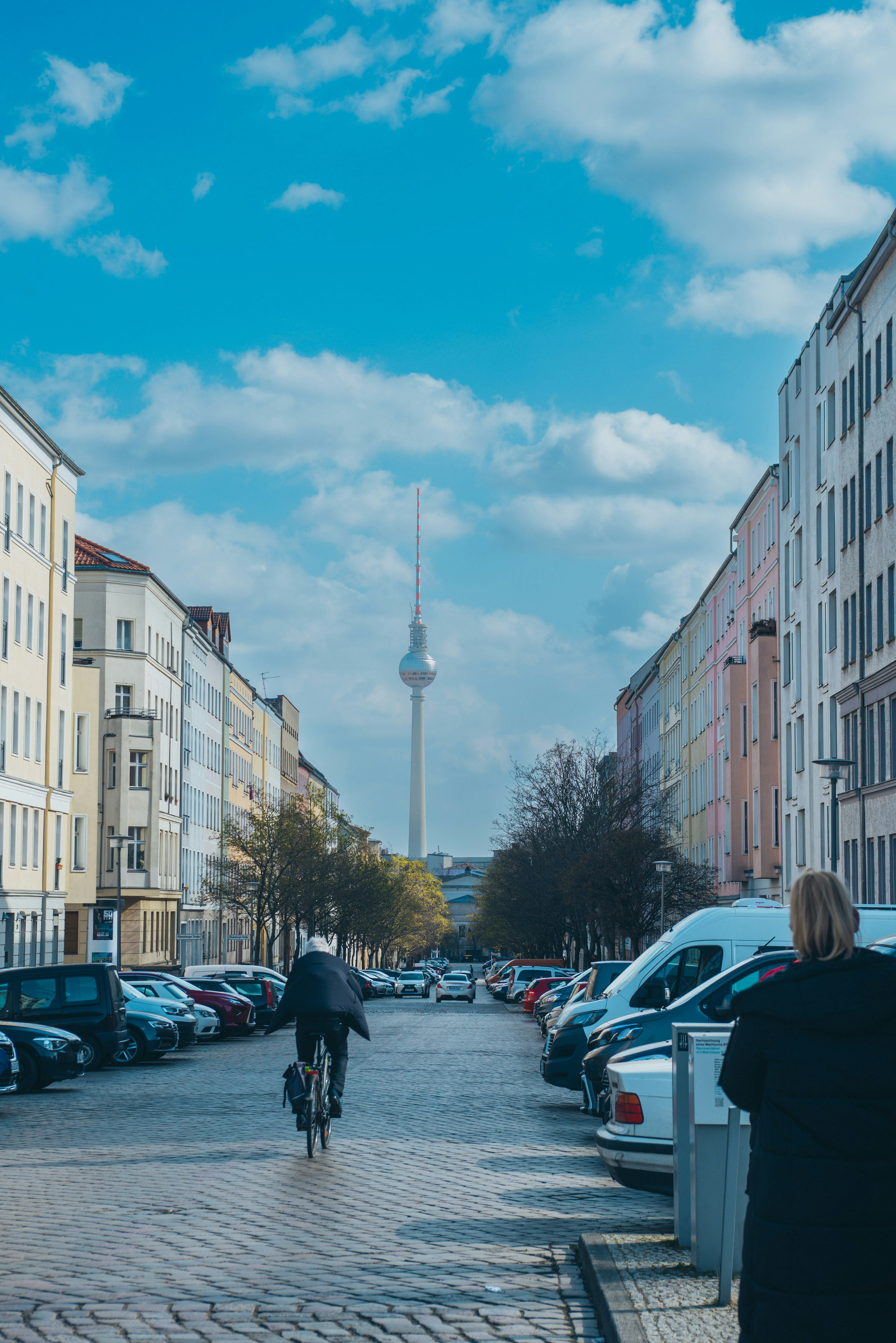 a city street with cars and people