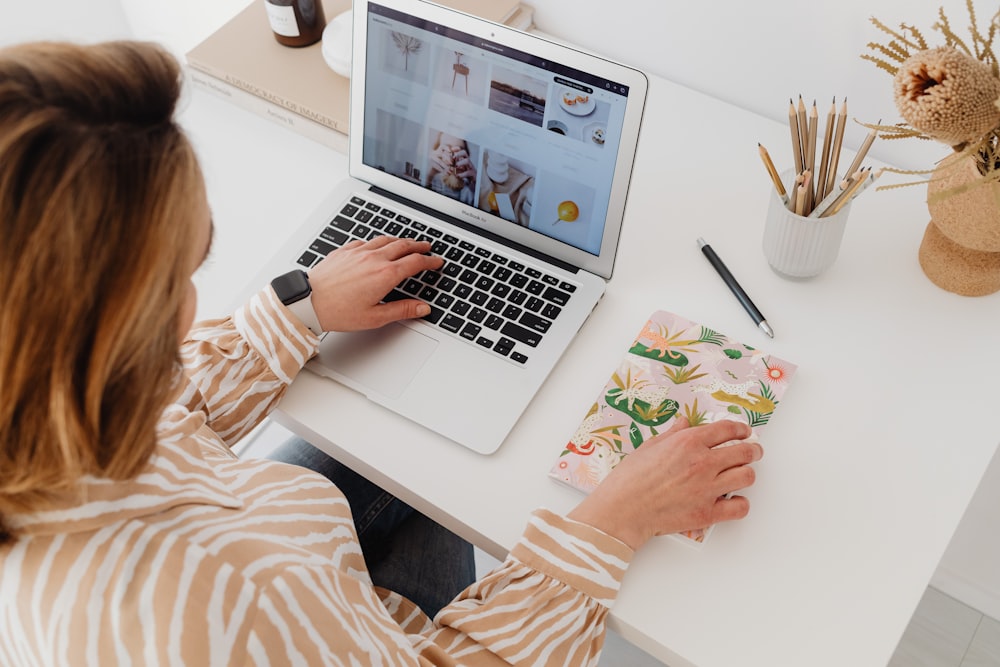 a woman working on a laptop