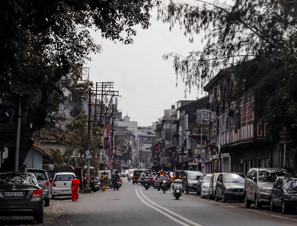 a busy street with cars and motorcycles