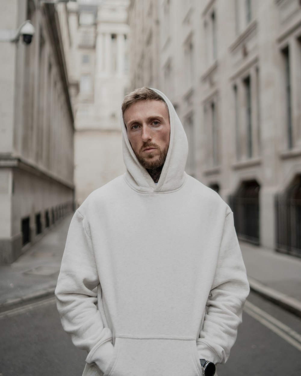 a man wearing a white coat