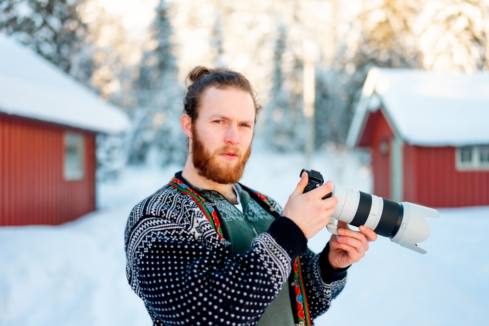 a man holding a snow shovel