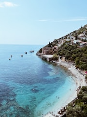 a beach with people and buildings