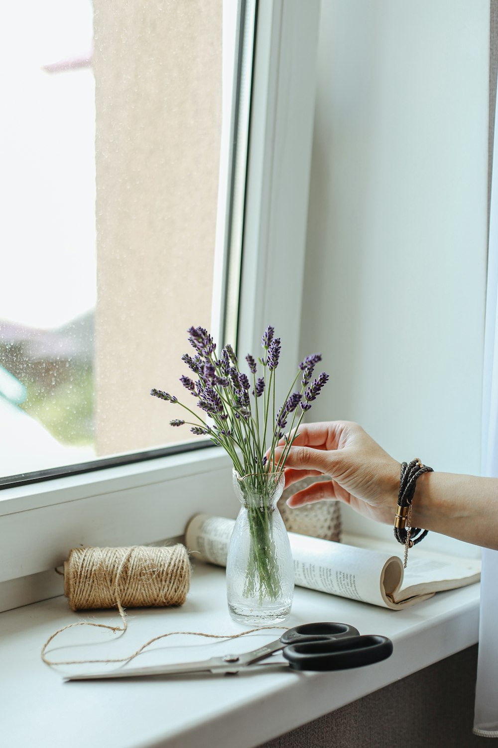 a vase with purple flowers