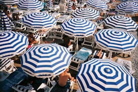 people sitting under umbrellas