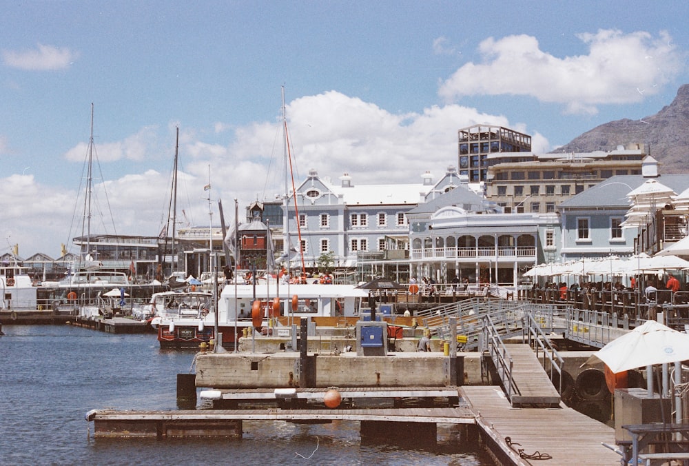 a dock with boats and buildings