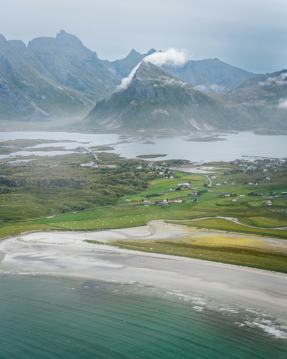 a landscape with mountains and water