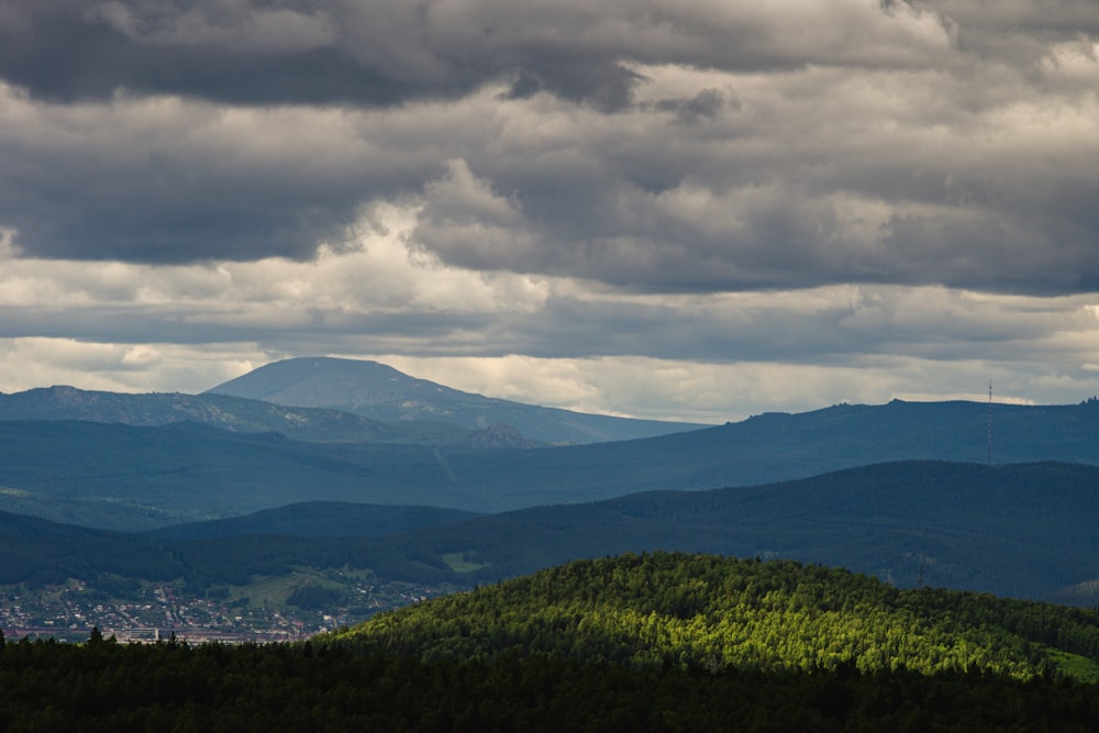 a mountain range with clouds