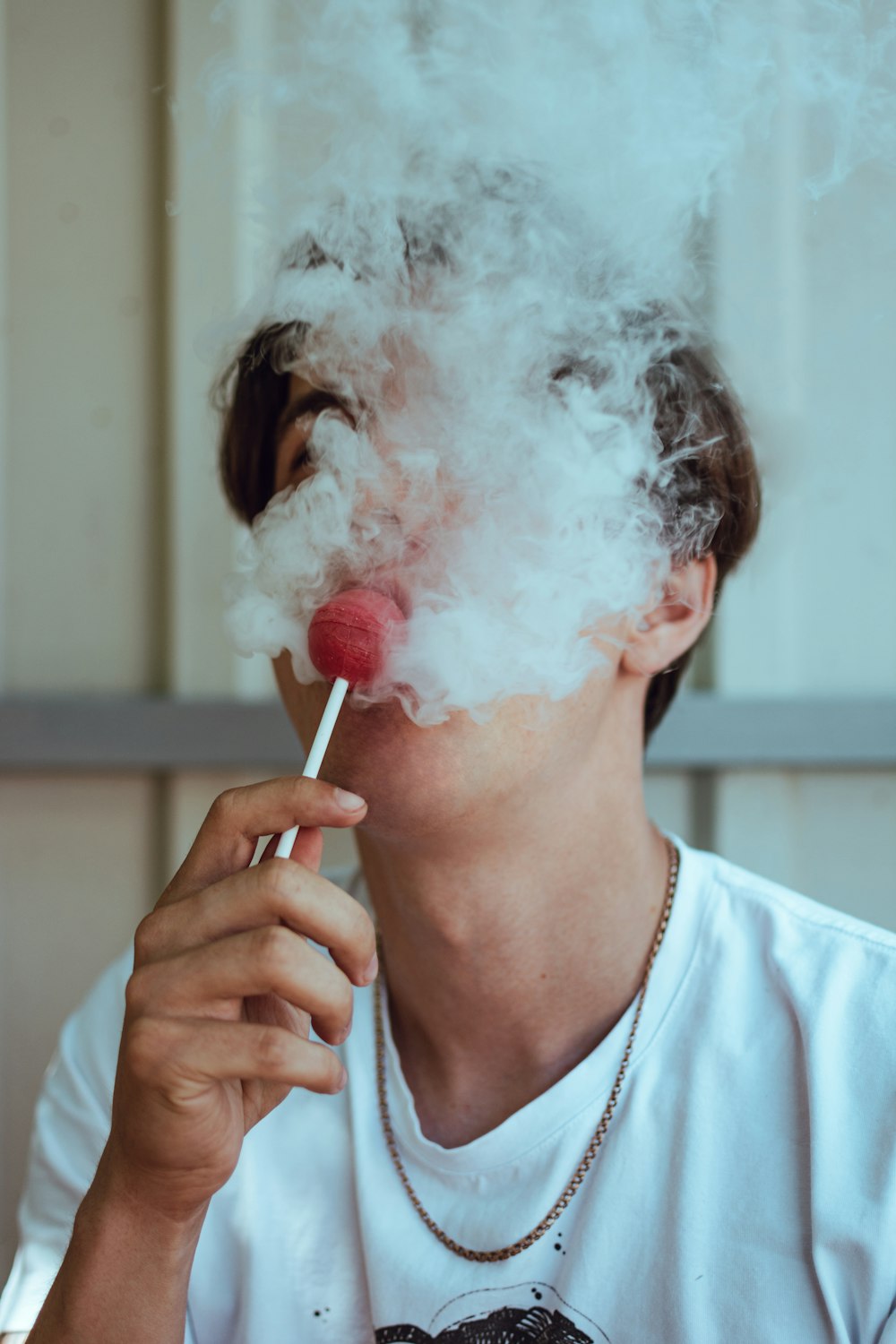a person with a cigarette in the mouth