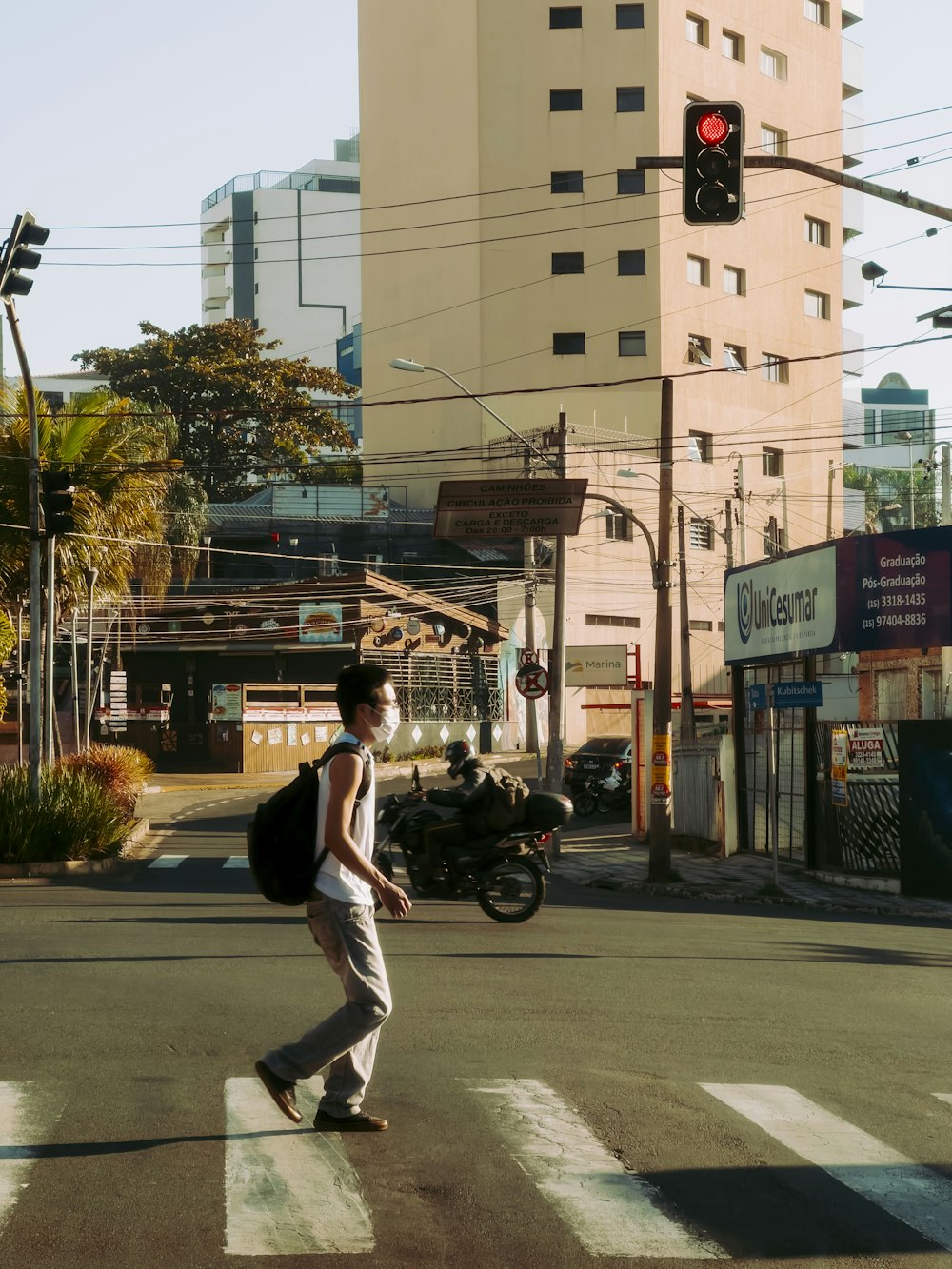 a person walking across a crosswalk